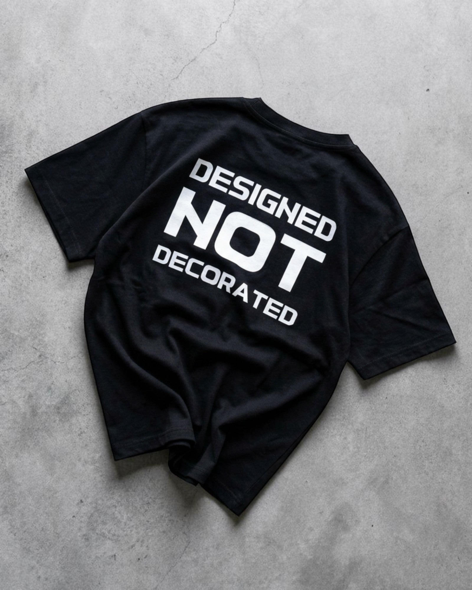 Unisex minimal streetwear cotton t-shirt black DESIGNED NOT DECORATED graphic print