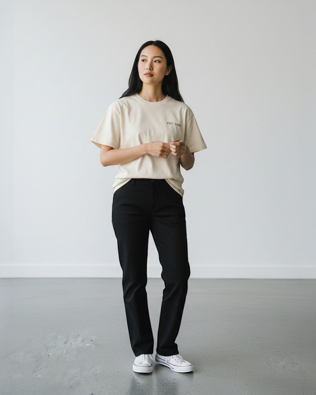 FALLR wear beige 100% cotton oversized t-shirt with minimalist graphic print, paired with black trousers.
