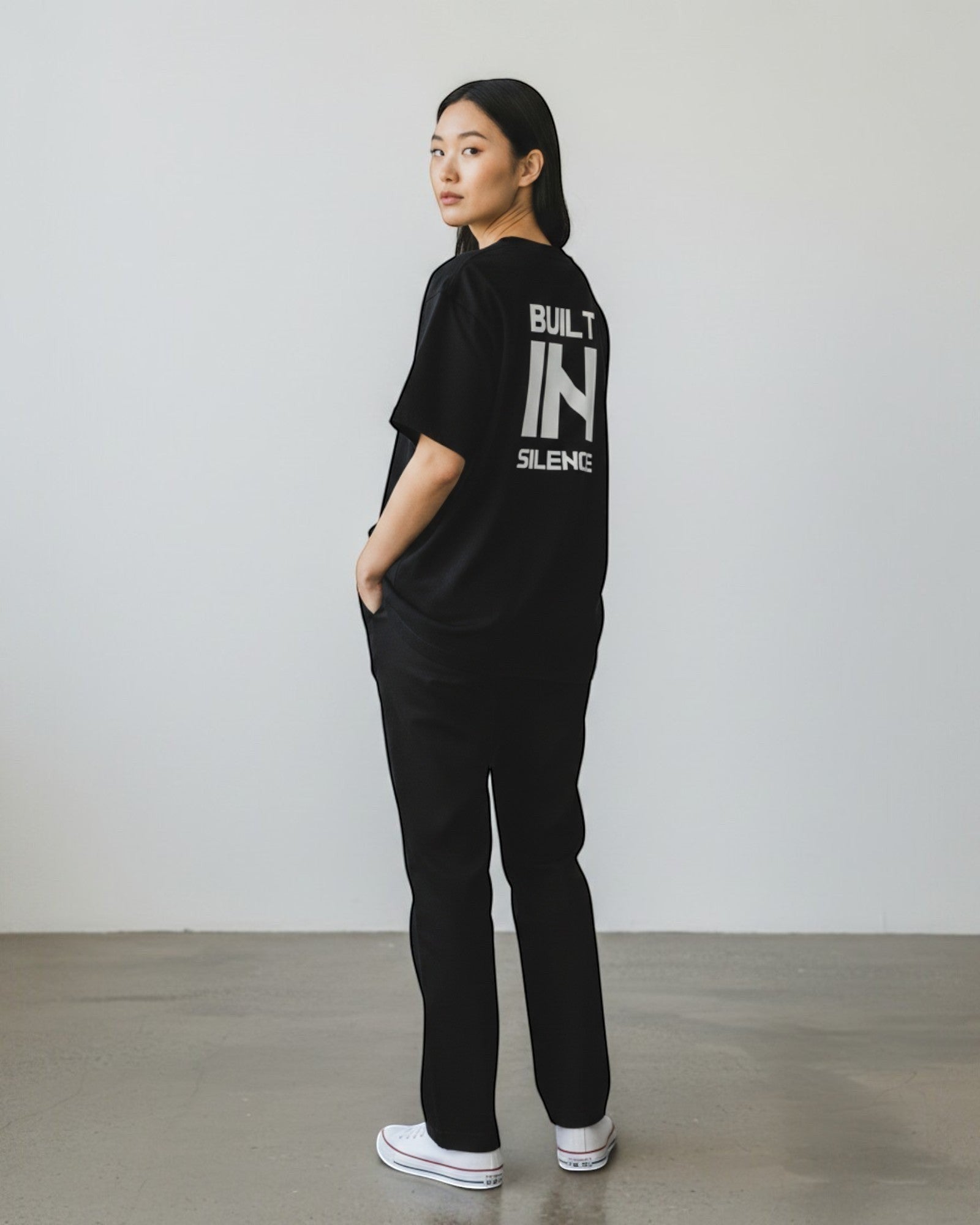 FALLR wear black 100% cotton oversized t-shirt with white "BUILT IN SILENCE" graphic print on back. Unisex streetwear.