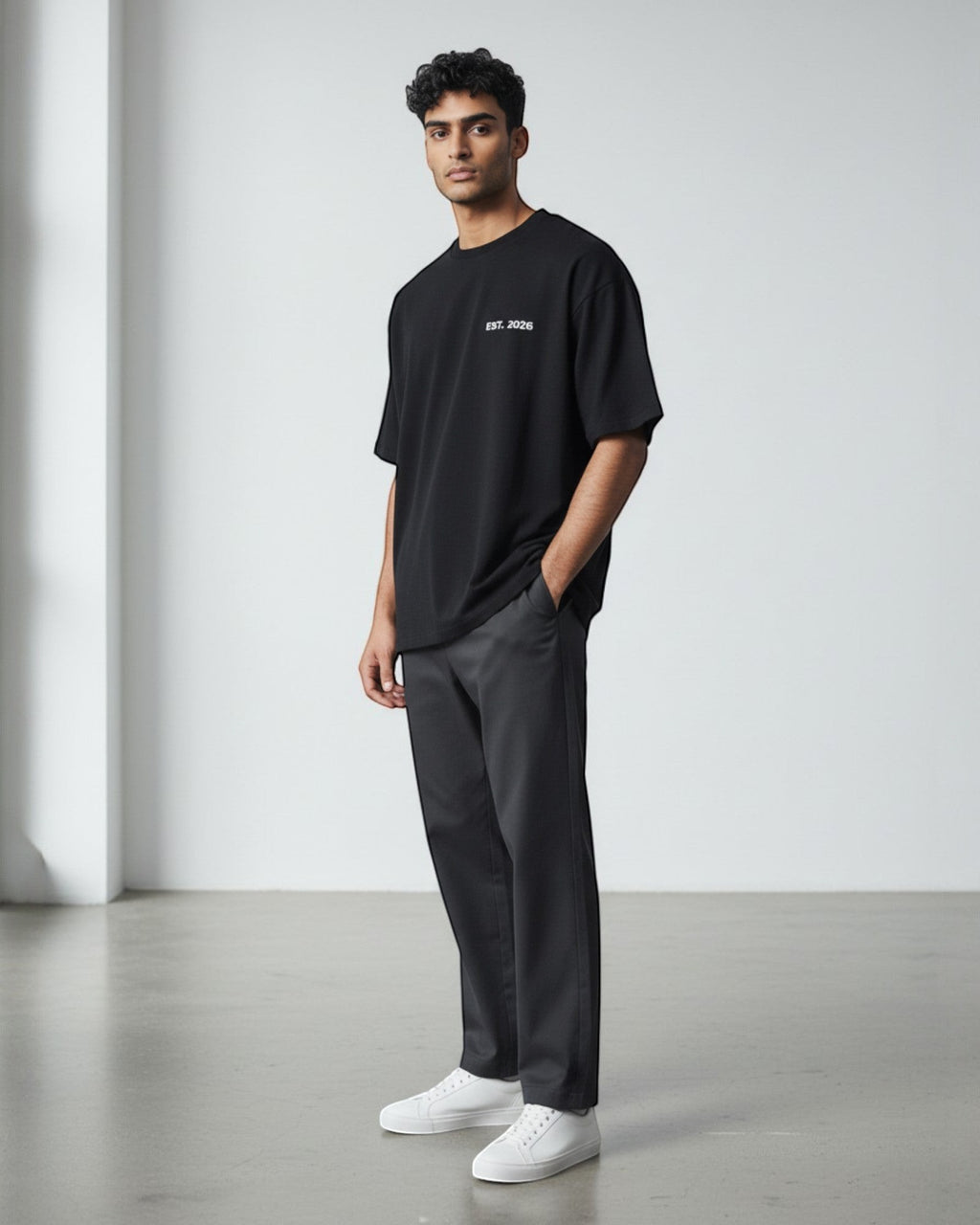 FALLR wear black 100% cotton oversized unisex t-shirt with subtle 'EST. 2026' print on chest.