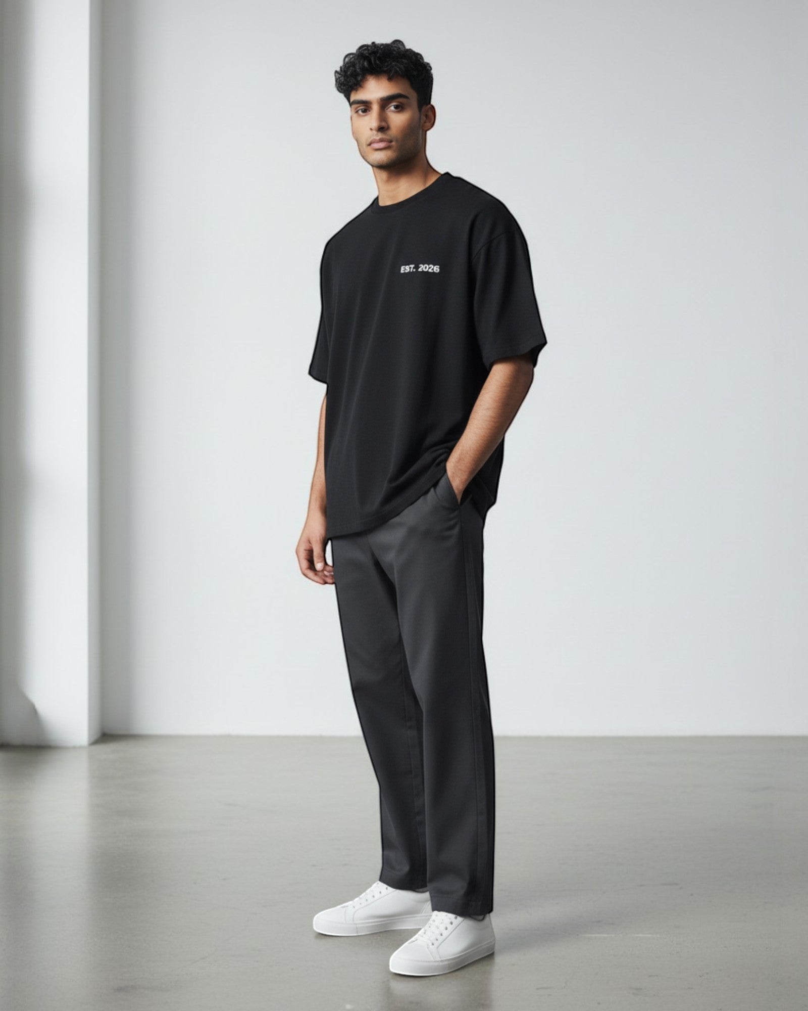FALLR wear black 100% cotton oversized unisex t-shirt with subtle 'EST. 2026' print on chest.