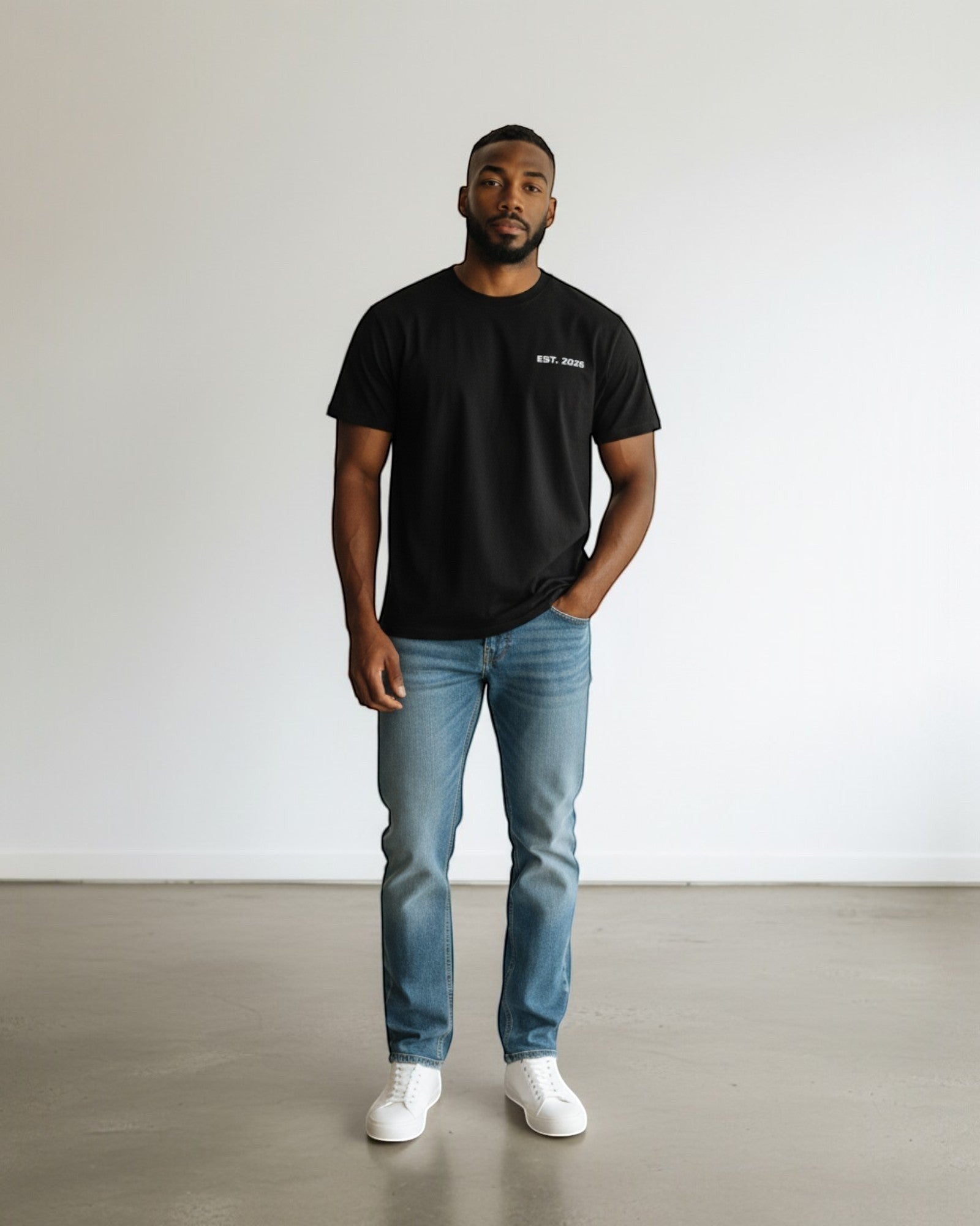 FALLR wear black 100% cotton oversized tee with minimalist graphic print and light wash denim jeans.