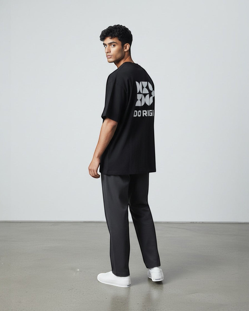 FALLR wear black 100% cotton oversized tee with geometric 'DO RIGHT' graphic print on back. Model is wearing relaxed fit.