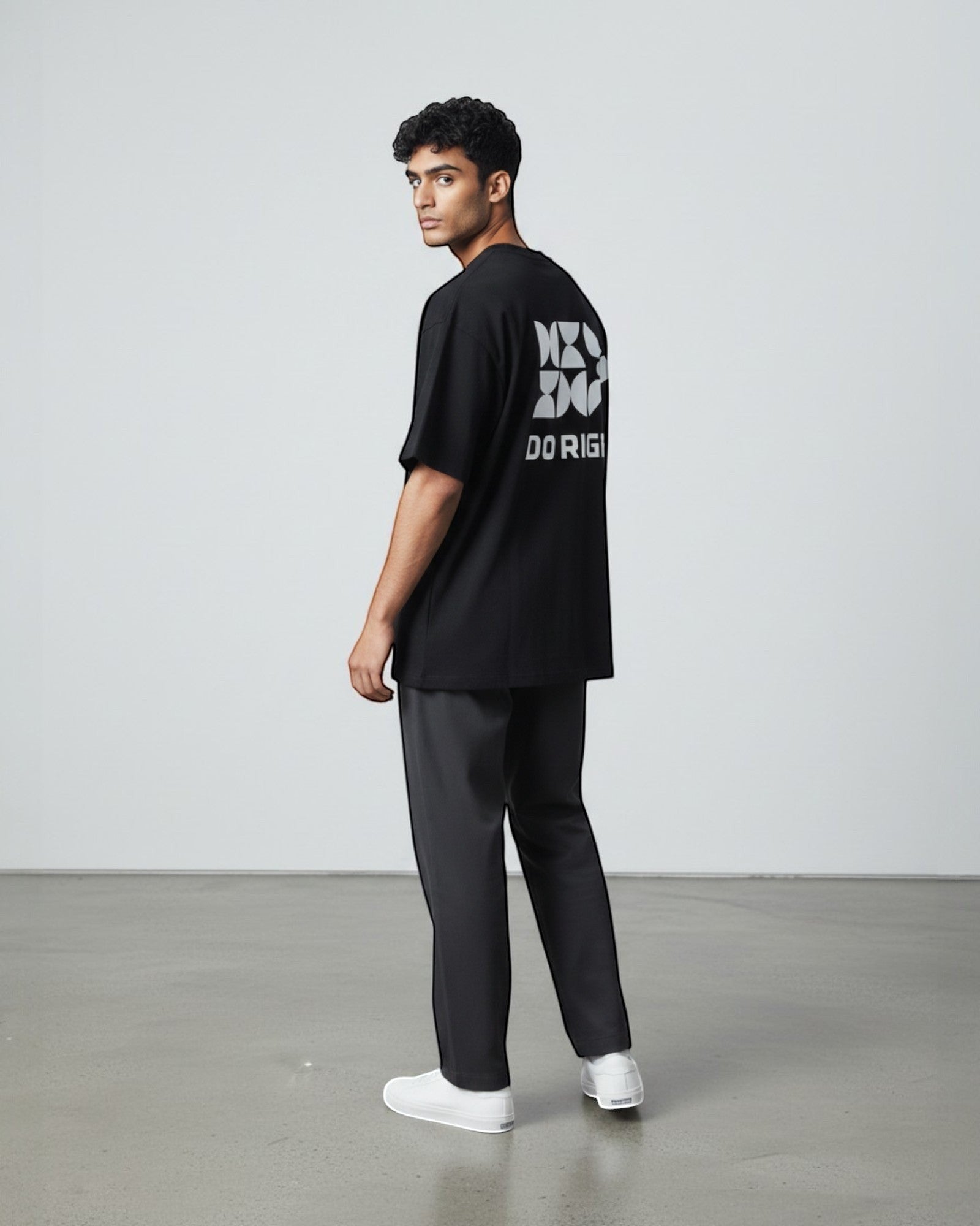 FALLR wear black 100% cotton oversized tee with geometric 'DO RIGHT' graphic print on back. Model is wearing relaxed fit.