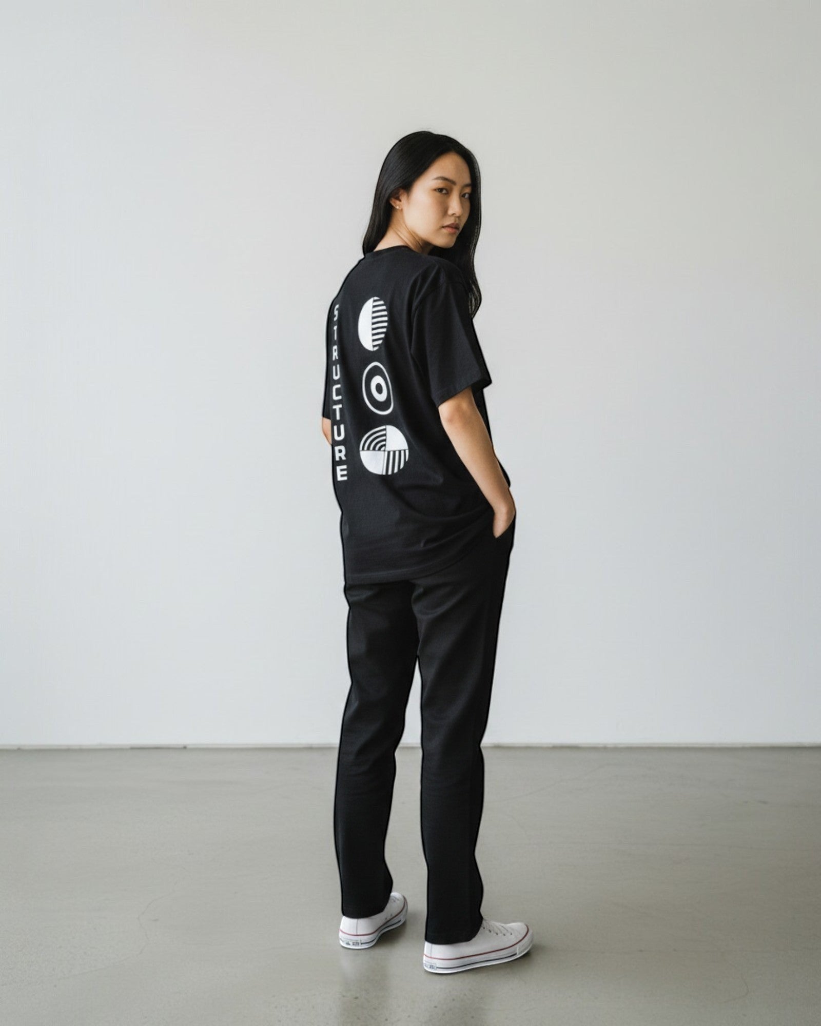 FALLR wear black 100% cotton oversized tee with a minimalist graphic print on the back. Unisex streetwear design.