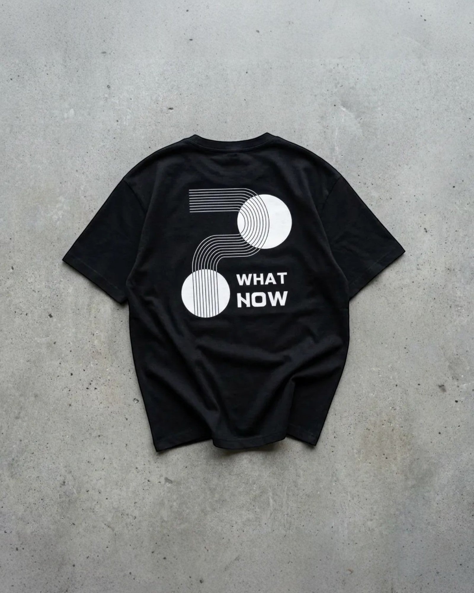 FALLR wear black 100% cotton t-shirt with white geometric graphic print and "WHAT NOW" text.