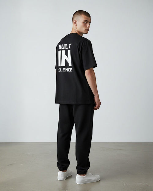 FALLR wear black 100% cotton oversized graphic t-shirt with "BUILT IN SILENCE" print on back