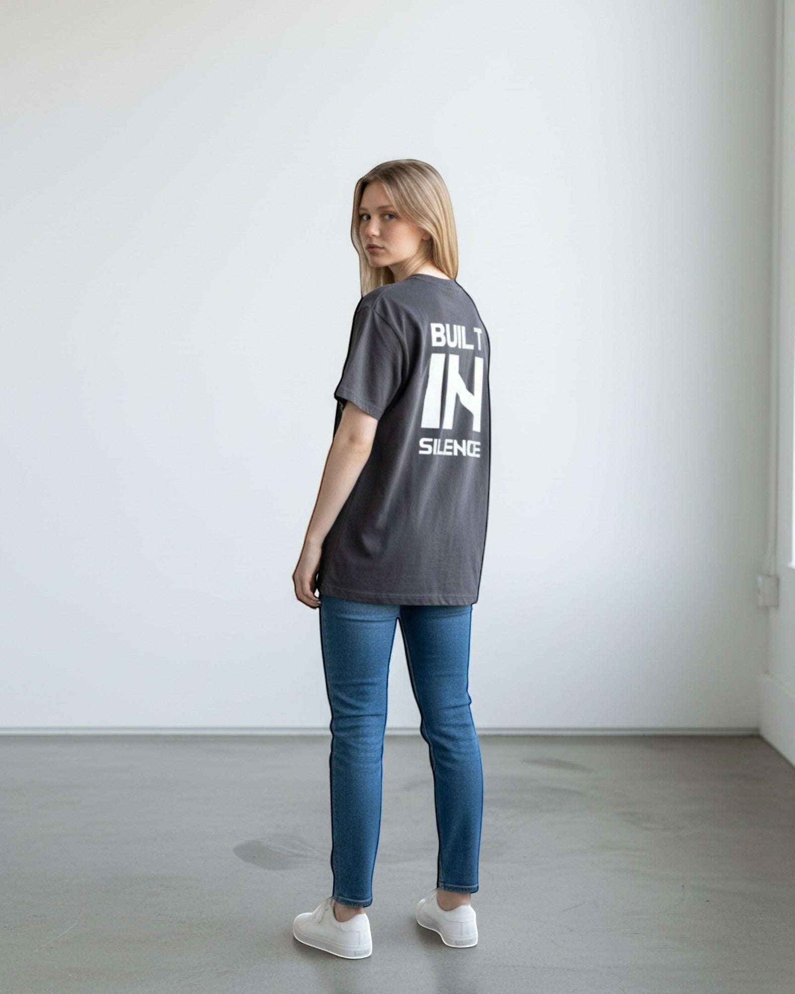 FALLR wear dark grey 100% cotton oversized graphic print t-shirt with "BUILT IN SILENCE" text on back.
