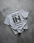 FALLR wear grey 100% cotton oversized graphic print t-shirt with "BUILT IN SILENCE" text on back.