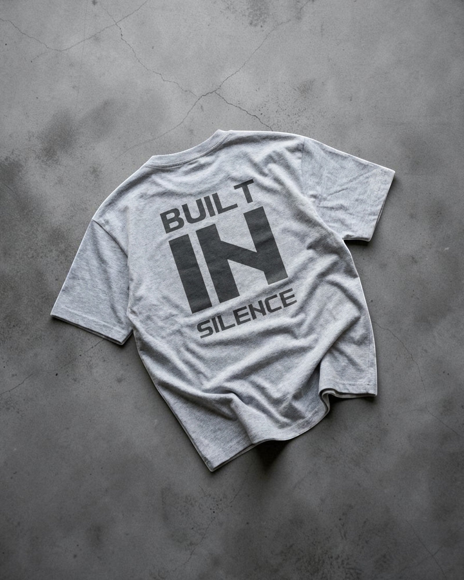 FALLR wear grey 100% cotton oversized graphic print t-shirt with "BUILT IN SILENCE" text on back.