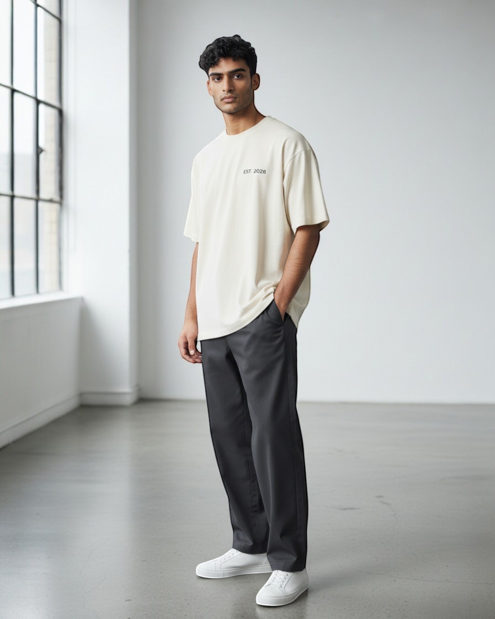 FALLR wear men's oversized cream 100% cotton t-shirt with minimalist black 'EST. 2026' graphic on chest.