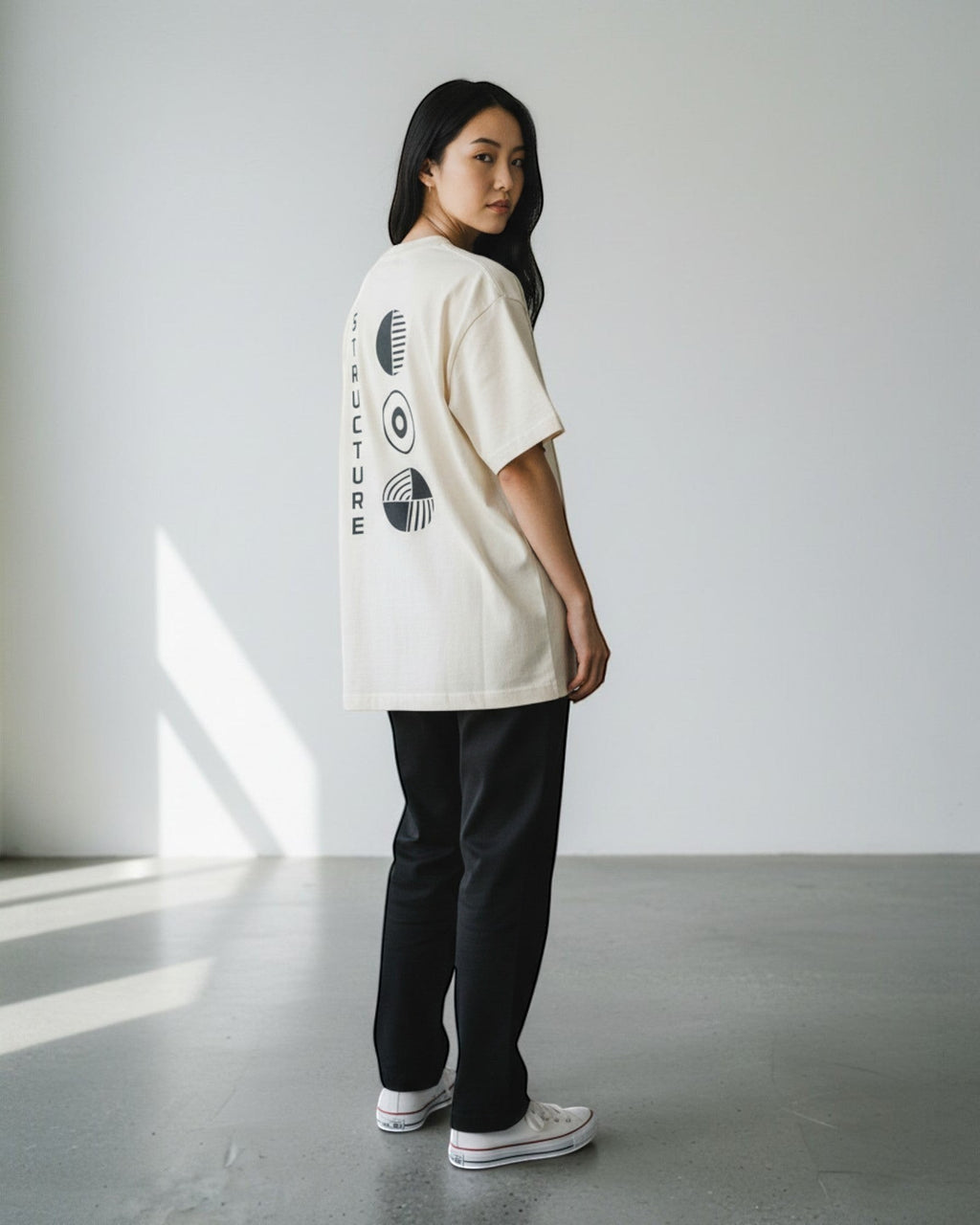 FALLR wear cream 100% cotton oversized tee with black abstract graphic print on back and vertical text.