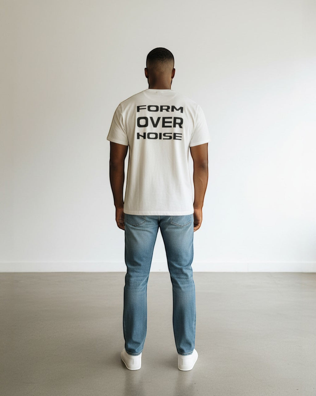 FALLR wear cream 100% cotton t-shirt with black 'FORM OVER NOISE' graphic print on back, worn by a man.