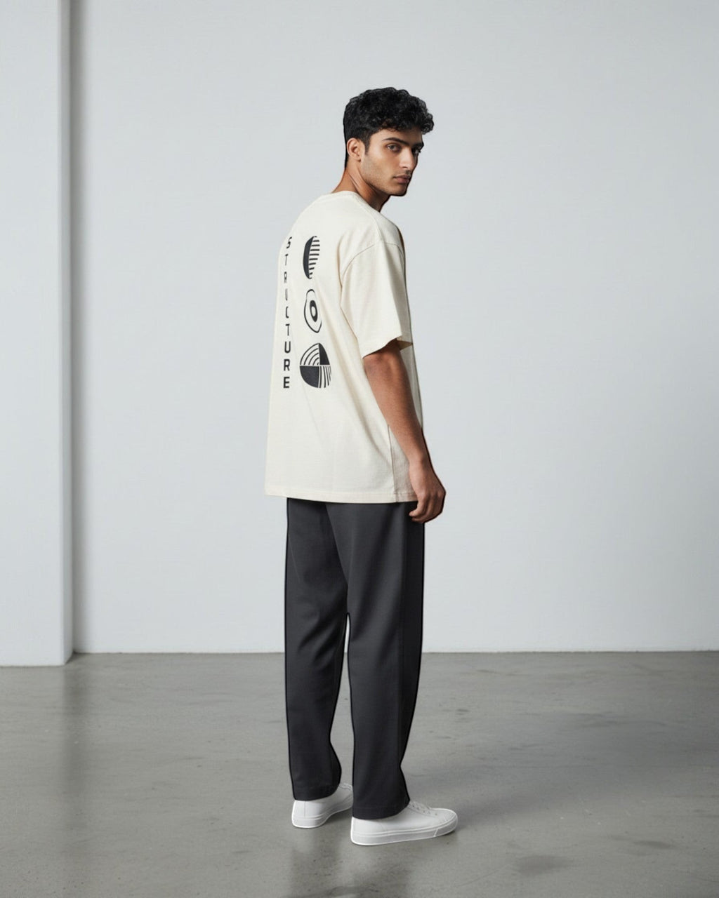 FALLR wear cream 100% cotton oversized tee with black graphic print on back and vertical text.