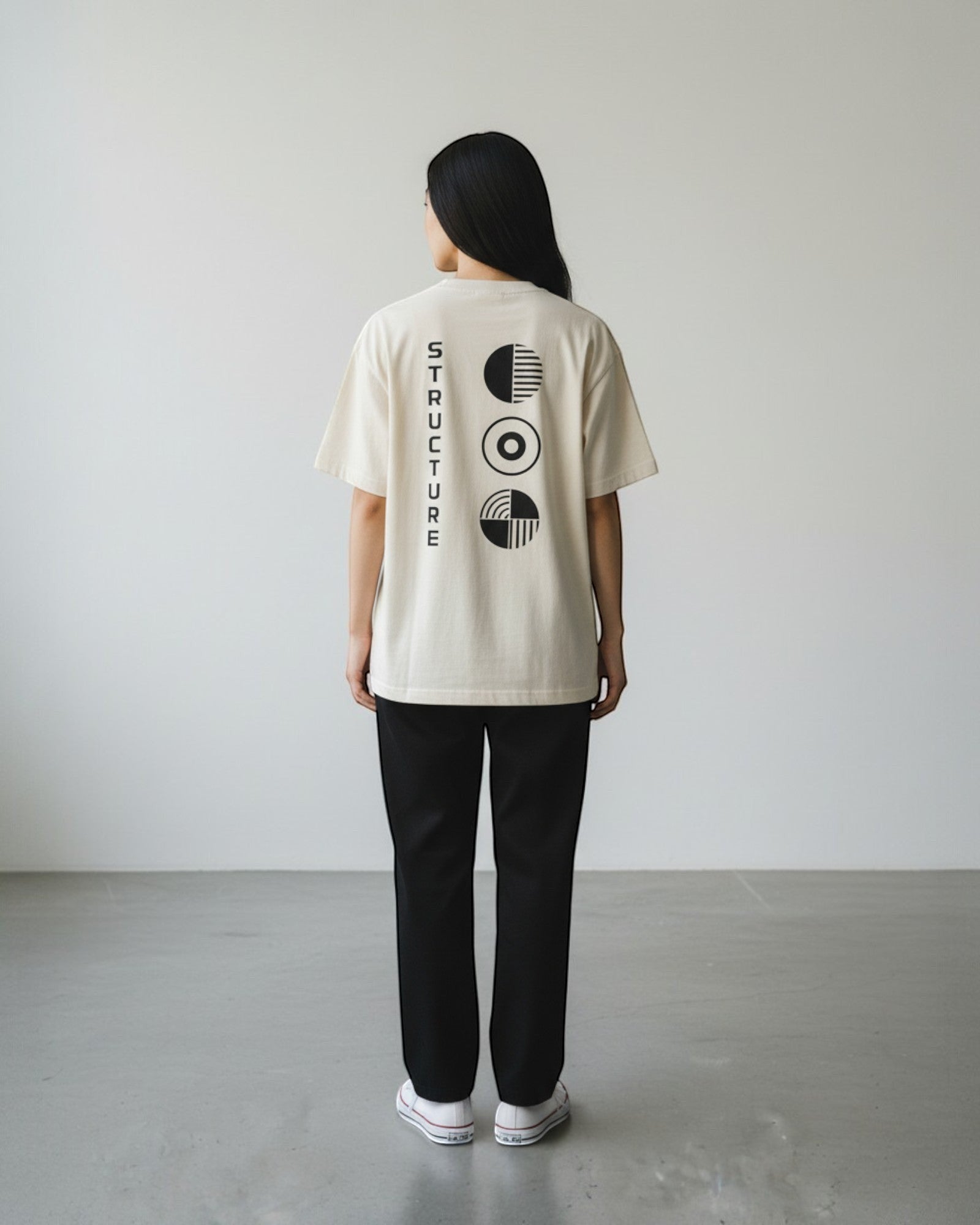 FALLR wear cream 100% cotton oversized tee with black graphic print on back and vertical text.