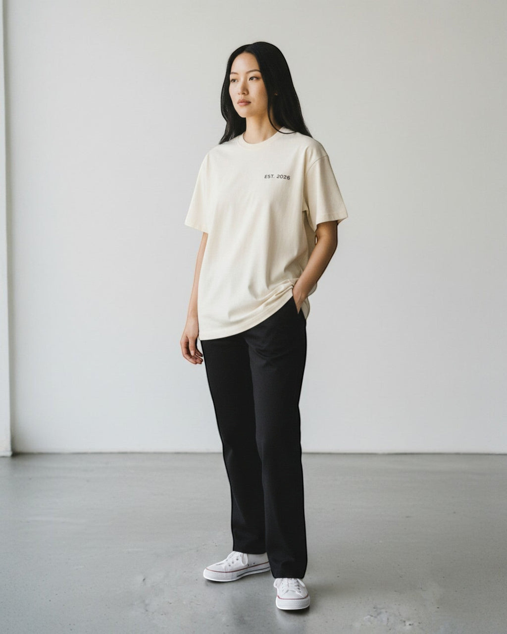 FALLR wear cream 100% cotton oversized tee with minimalist black 'EST. 2026' graphic on chest.
