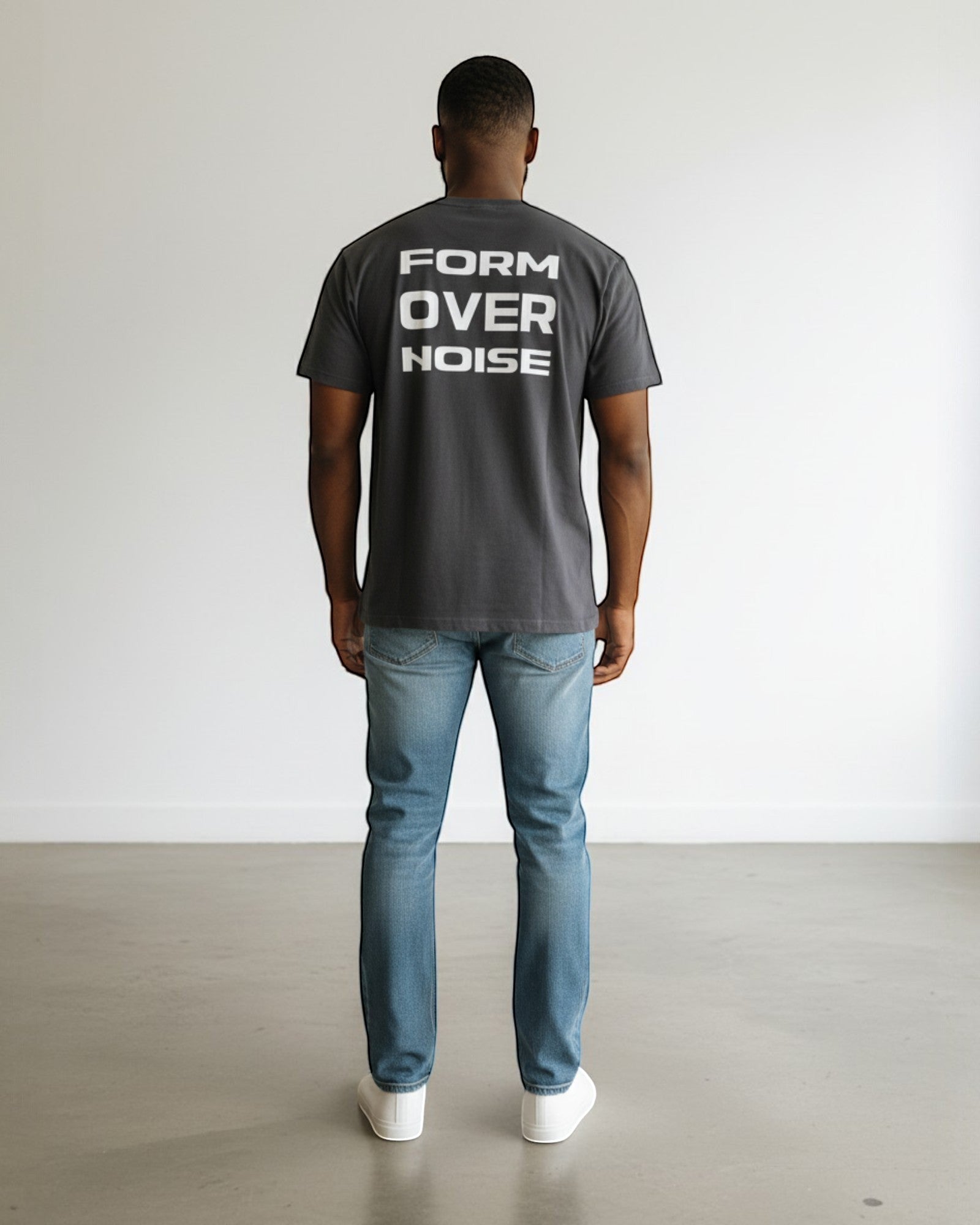 FALLR wear dark grey 100% cotton t-shirt with white 'FORM OVER NOISE' graphic print on back, worn by a man.