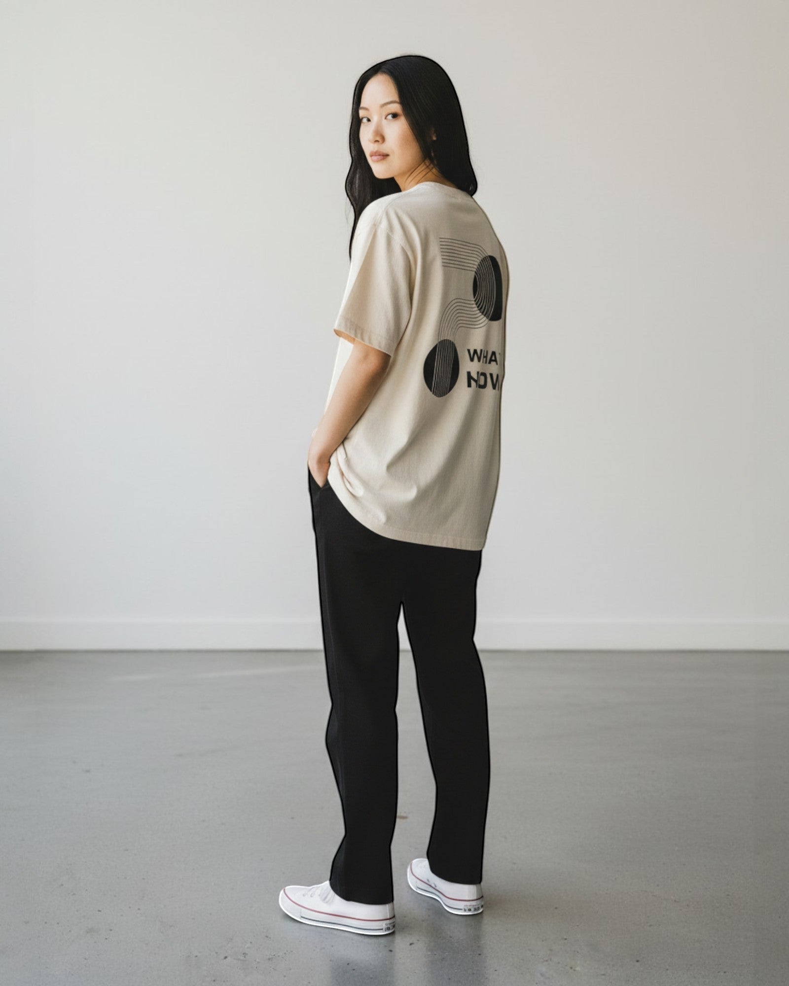 FALLR wear beige 100% cotton t-shirt with "What Now" graphic print on back, relaxed fit, unisex streetwear.