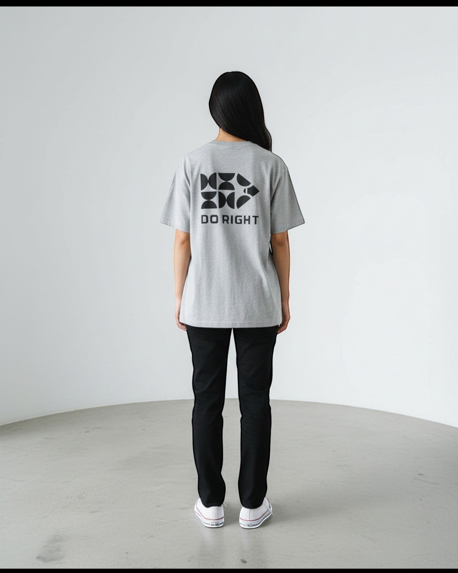 FALLR wear grey 100% cotton oversized t-shirt with black 'DO RIGHT' graphic print on back, worn by a woman.