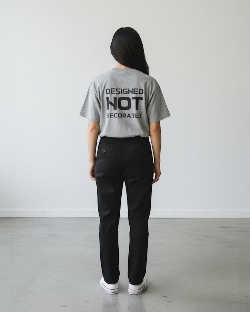 FALLR wear grey 100% cotton unisex oversized t-shirt with black 'DESIGNED NOT DECORATED' graphic print on back.