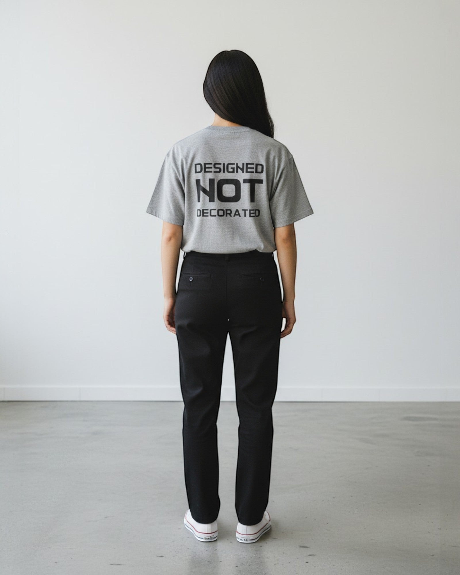 FALLR wear grey 100% cotton unisex oversized t-shirt with black 'DESIGNED NOT DECORATED' graphic print on back.