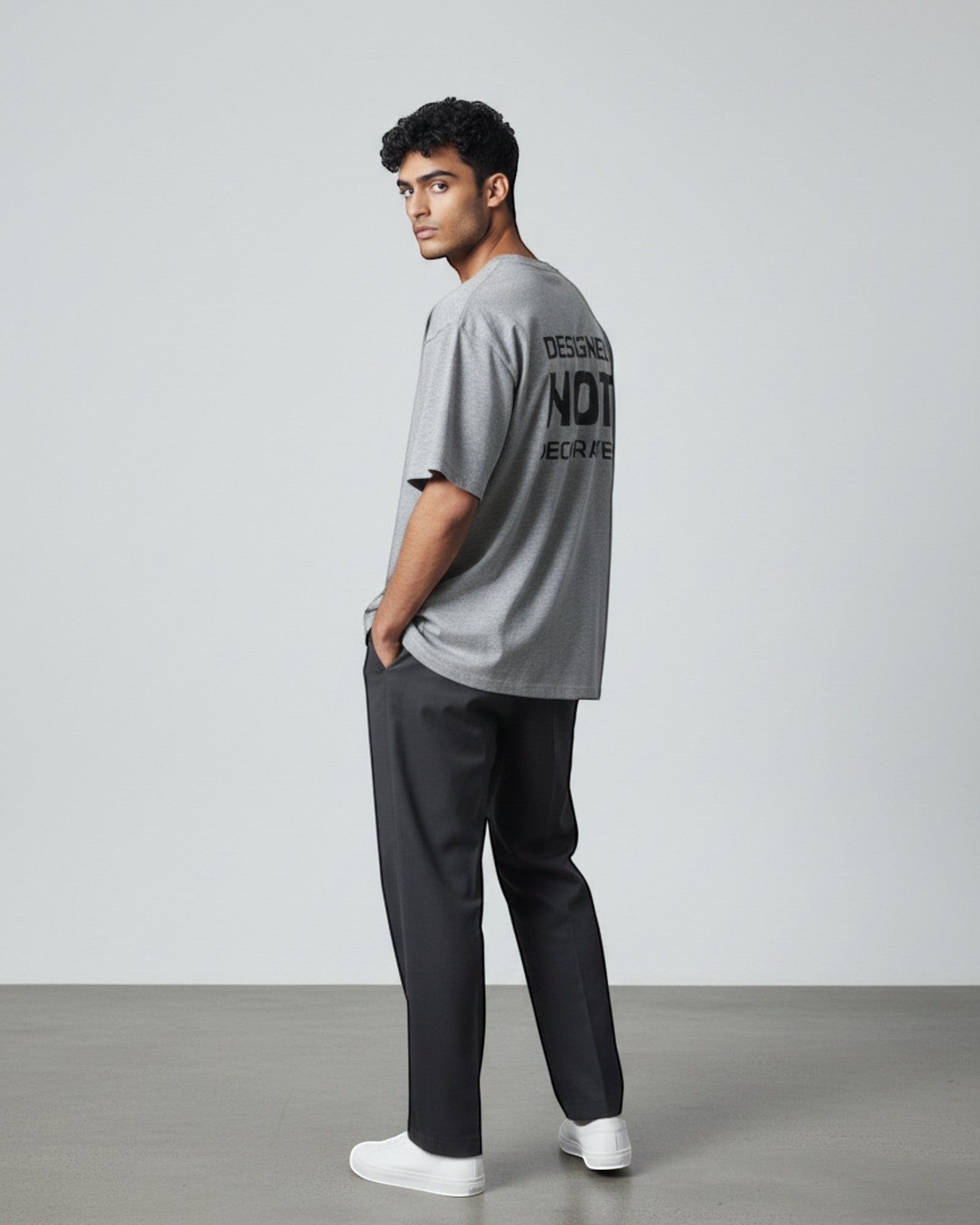 FALLR wear grey 100% cotton oversized unisex t-shirt with black 'Designed Not Decorated' graphic print on back.