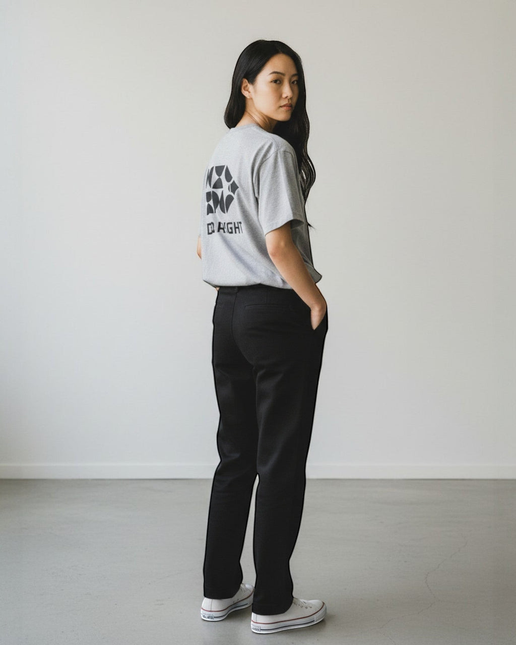 FALLR wear grey 100% cotton oversized t-shirt with black graphic print on back, paired with black trousers.