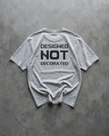 FALLR wear grey 100% cotton unisex oversized t-shirt with black 'DESIGNED NOT DECORATED' graphic print on back.