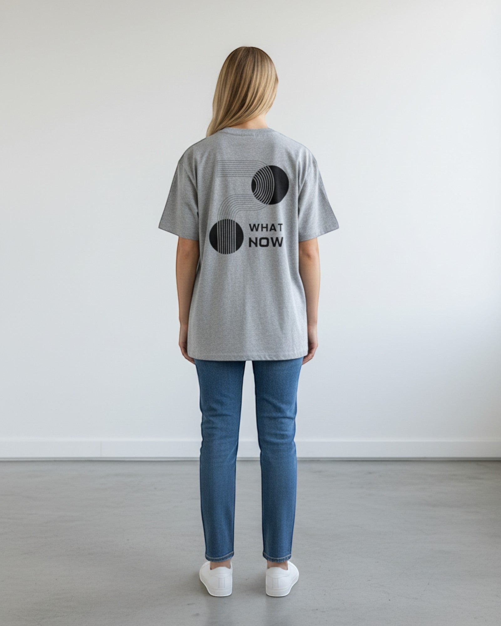 FALLR wear grey 100% cotton oversized t-shirt with black 'What Now' graphic print on back.