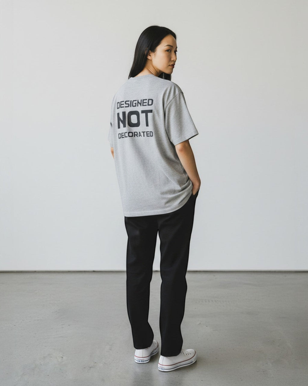 FALLR wear grey 100% cotton unisex oversized t-shirt with black 'Designed Not Decorated' graphic print on back.