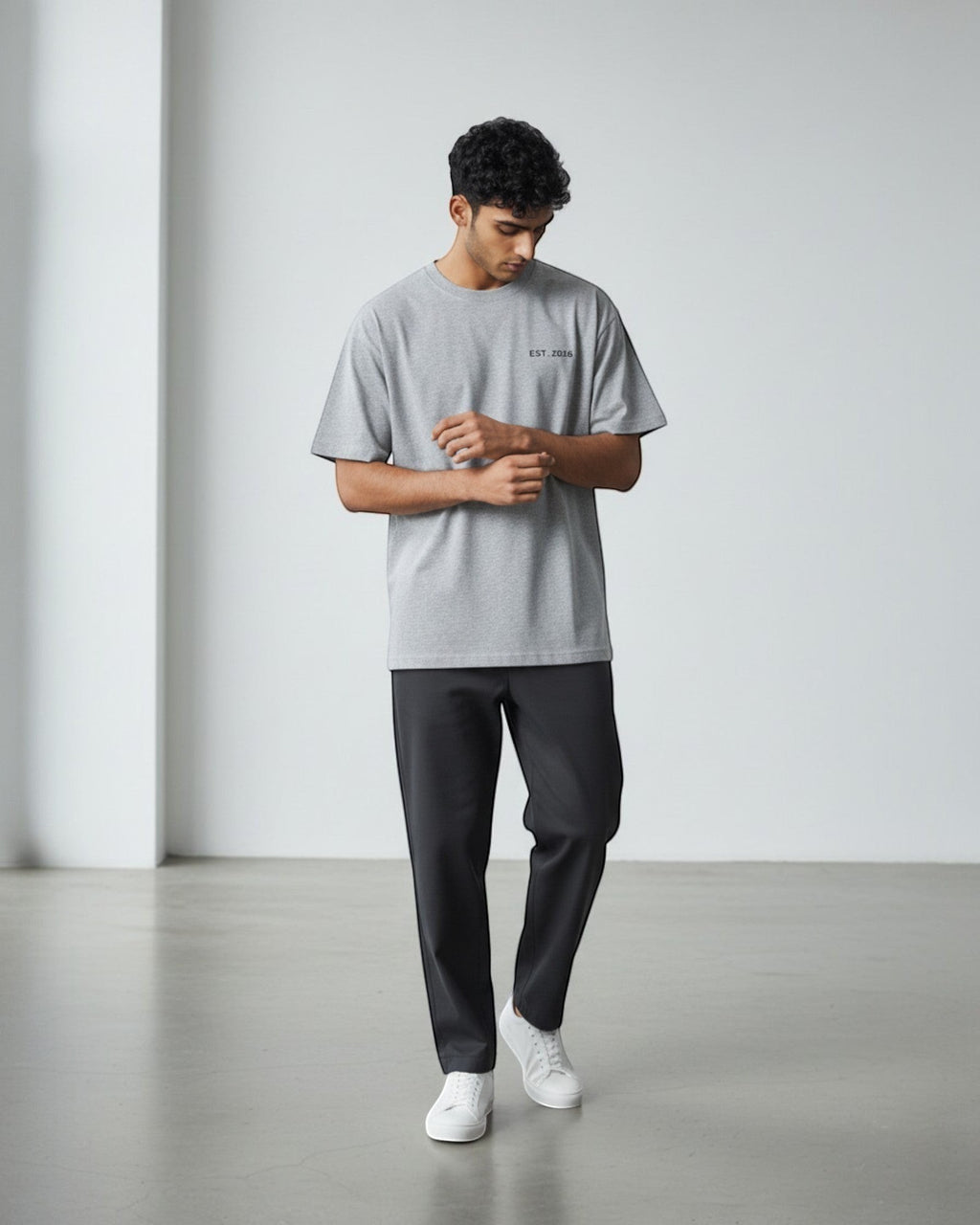 FALLR wear grey 100% cotton oversized t-shirt with minimalist graphic print and black trousers.