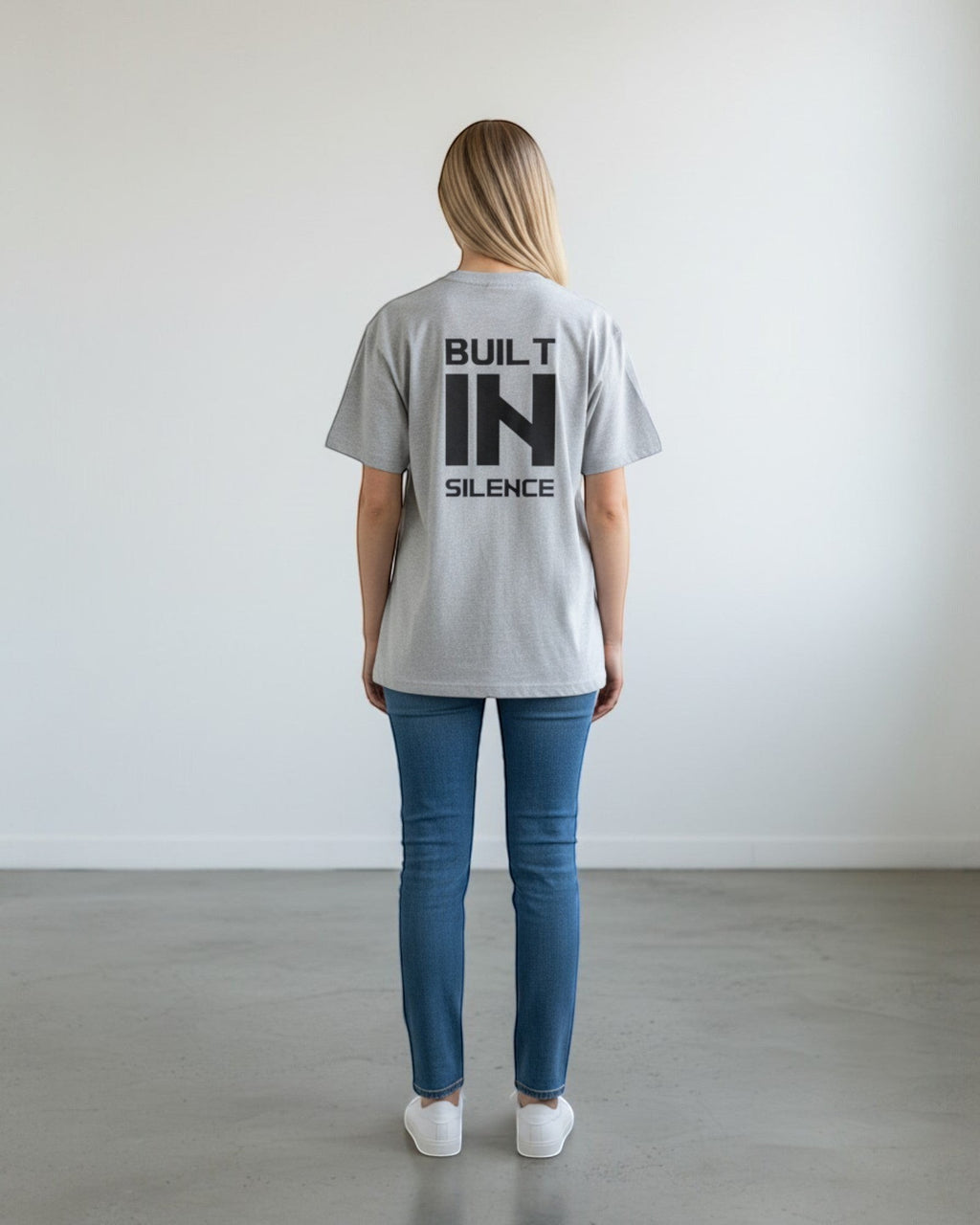 FALLR wear grey 100% cotton oversized t-shirt with black "BUILT IN SILENCE" graphic print on back.