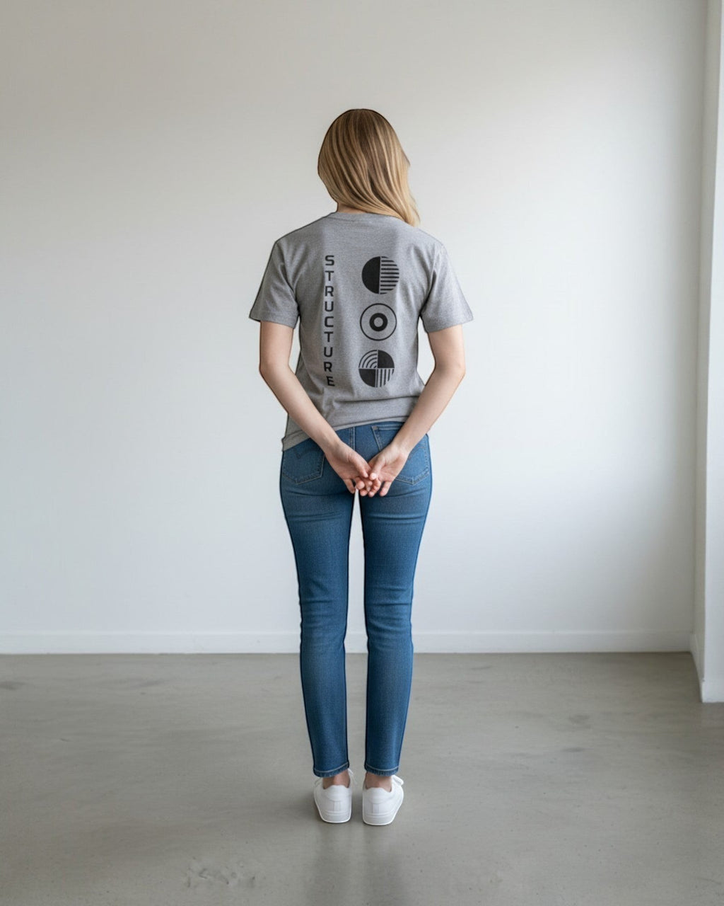 FALLR wear grey 100% cotton unisex oversized t-shirt with black graphic print on back. Model wears jeans.