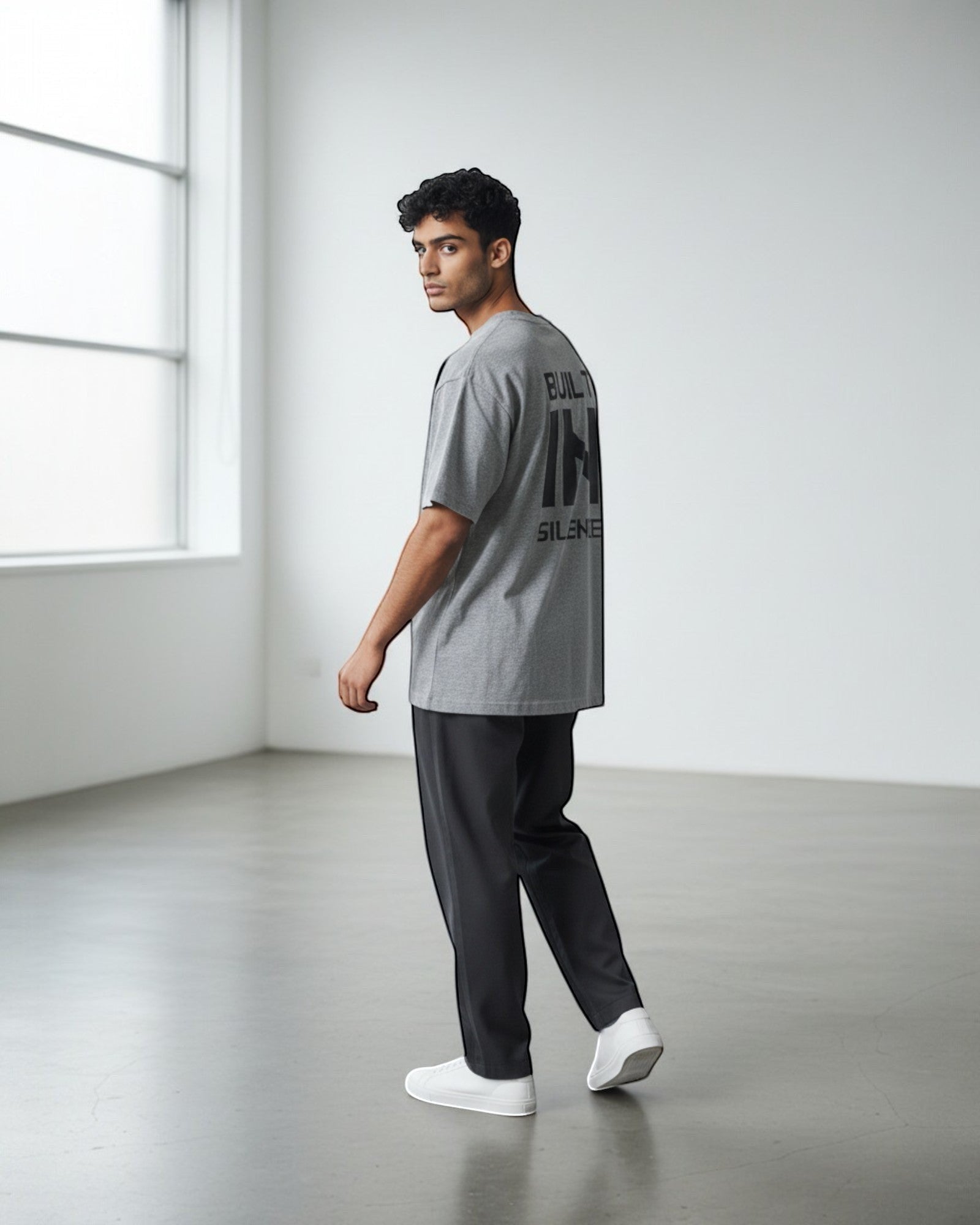 FALLR wear grey 100% cotton oversized t-shirt with black "BUILT IN SILENCE" graphic print on back.