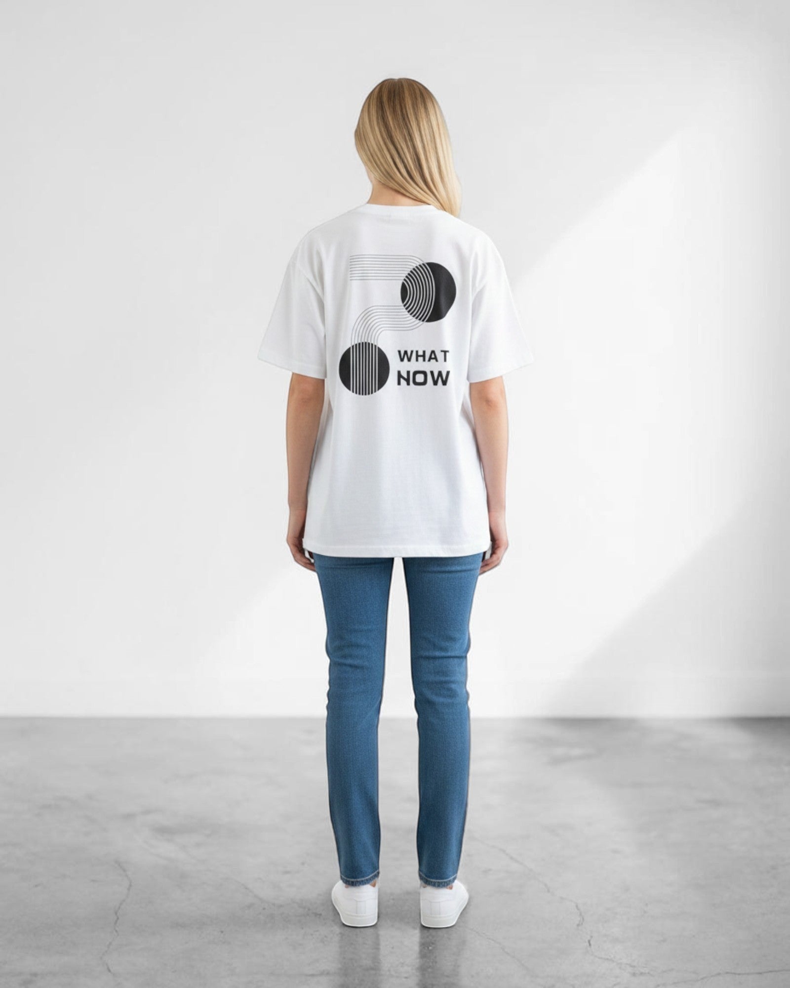 FALLR wear white 100% cotton oversized t-shirt with black geometric "What Now" graphic print on back.