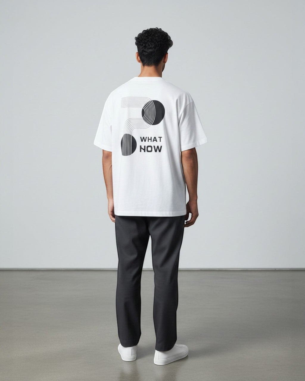 FALLR wear white 100% cotton oversized t-shirt with black geometric 'What Now' graphic print on back.
