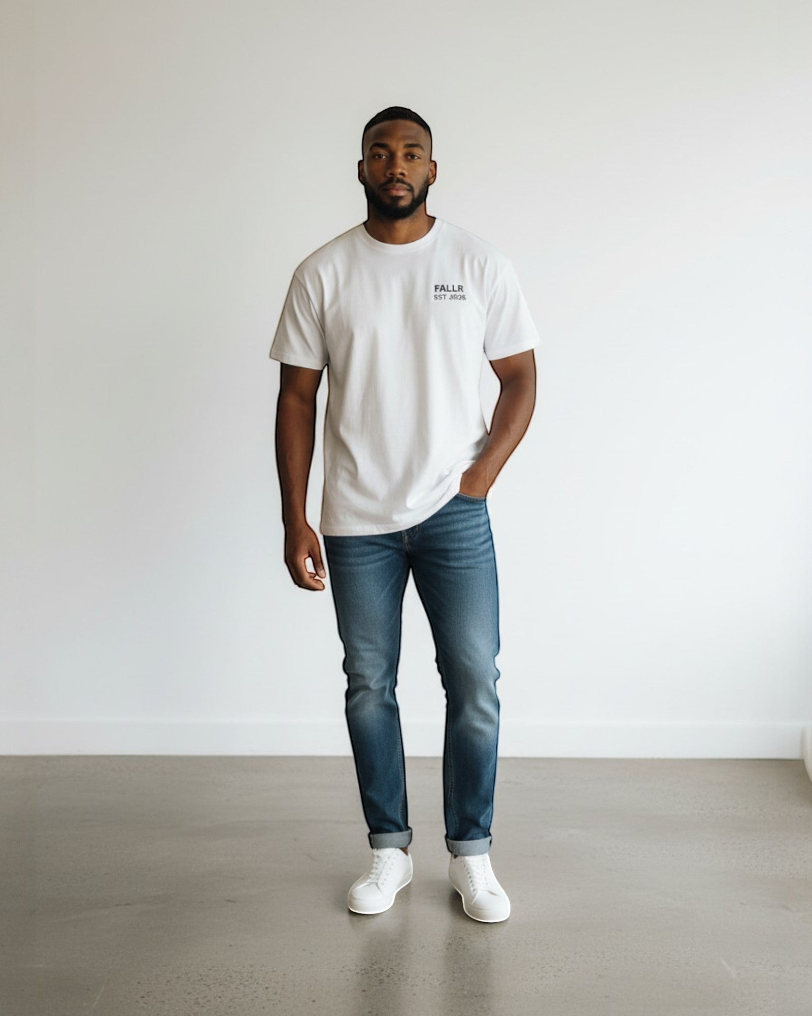 FALLR wear white 100% cotton oversized graphic print t-shirt on a man wearing blue jeans.