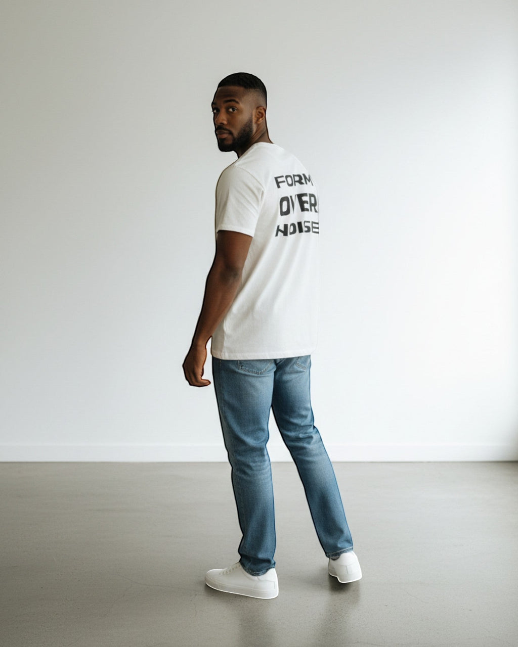 FALLR wear white 100% cotton t-shirt with black 'Form Over Noise' graphic print on back, worn by a man in jeans.